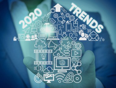 2020 Trendlerini gösteren not yazma. Mevcut yıl erkek tanıtım akıllı cihaz sunan resmi iş elbisesi giymek kısa bir süre için ünlü şeyler vitrine.