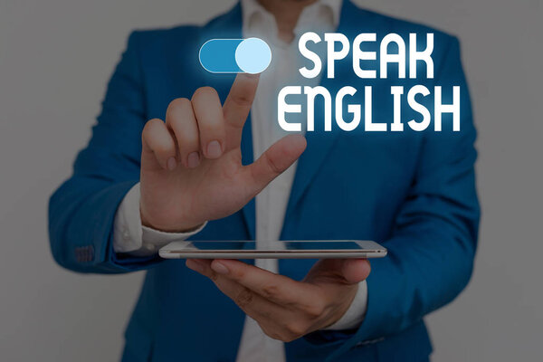 Word writing text Speak English. Business concept for Study another Foreign Language Online Verbal Courses Male human wear formal work suit presenting presentation using smart device.