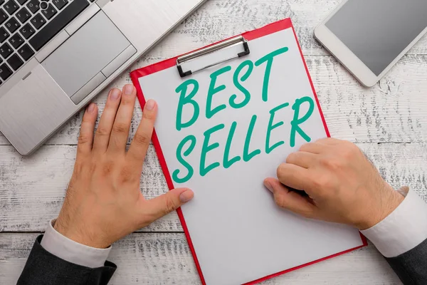 Konzeptionelle Handschrift, die Bestseller zeigt. Business-Fototextbuch oder anderes Produkt, das sich in sehr großer Zahl verkauft. — Stockfoto