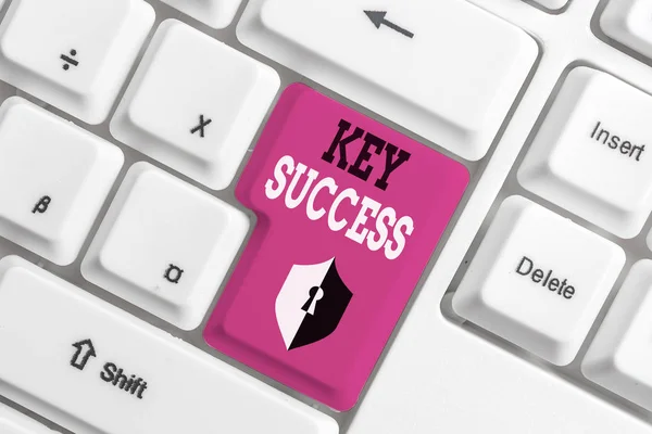 Text sign showing Key Success. Conceptual photo generally three to five areas that company may focus on White pc keyboard with empty note paper above white background key copy space.