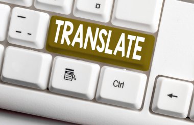 Translate gösteren kavramsal el yazısı. İş fotoğraf metni Hedef dil beyaz bilgisayar klavyesi ile aynı eşdeğer anlamı olan başka bir kelime beyaz arka plan üzerinde not kağıdı ile.