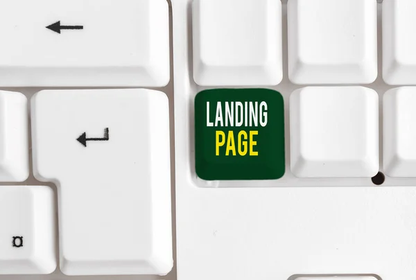 Conceptual hand writing showing Landing Page. Business photo showcasing Website accessed by clicking a link on another web page White pc keyboard with note paper above the white background. — Stock Photo, Image