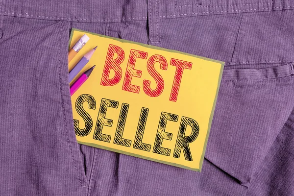 Handwriting text writing Best Seller. Concept meaning book or other product that sells in very large numbers Writing equipment and yellow note paper inside pocket of man work trousers.