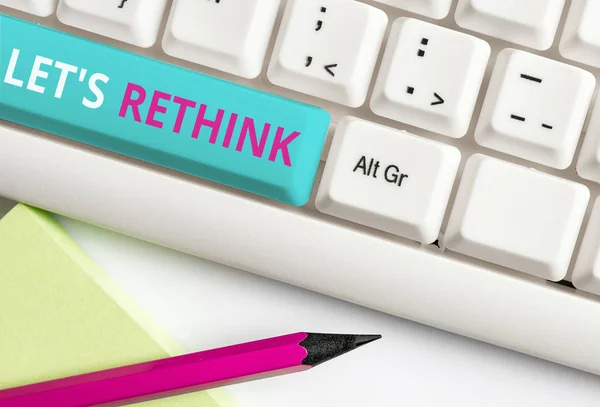 Handwriting text Let S Rethink. Concept meaning an Afterthought To Remember Reconsider Reevaluate White pc keyboard with empty note paper above white background key copy space. — Stock Photo, Image