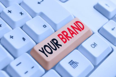 Markanızı yazan el yazısı metin. Kavram anlamı beyaz arka plan tuşu kopyalama alanı üzerinde boş not kağıdı ile marka Beyaz pc klavye olarak bir şey etkilenir her türlü bir isim.