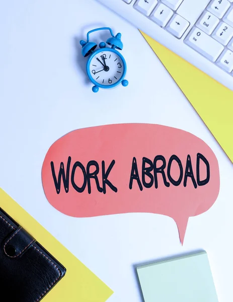 Word writing text Work Abroad. Business concept for Immersed in a foreign work environment Job Overseas Non Local Flat lay with copy space on bubble paper clock and paper clips. — Stock Photo, Image