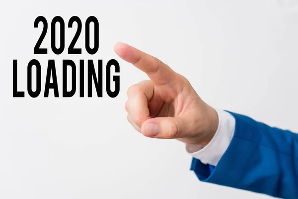 Writing note showing 2020 Loading. Business photo showcasing Advertising the upcoming year Forecasting the future event Isolated hand pointing with finger. Business concept pointing finger. — Stock Photo, Image