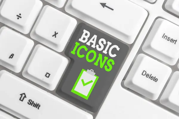 Handwriting text writing Basic Icons. Concept meaning pictogram or ideogram displayed on a computer screen or phone White pc keyboard with empty note paper above white background key copy space. — Stock Photo, Image