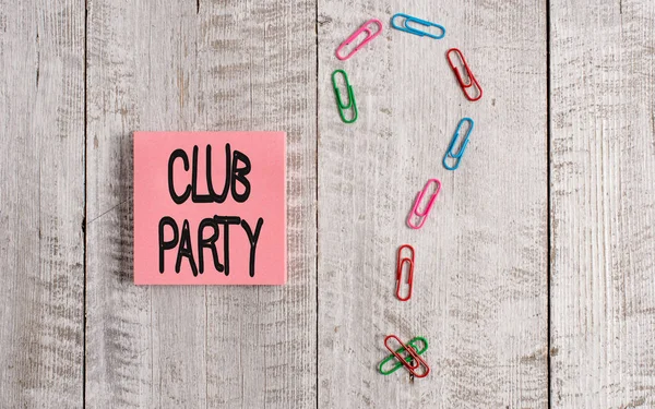 Writing note showing Club Party. Business photo showcasing social gathering in a place that is informal and can have drinks Pastel colour note paper placed next to stationary above wooden table. — Stockfoto