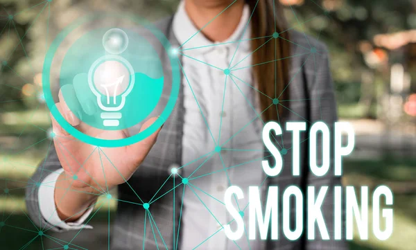 Handwriting text Stop Smoking. Concept meaning Discontinuing or stopping the use of tobacco addiction Female human wear formal work suit presenting presentation use smart device. — Stock Photo, Image