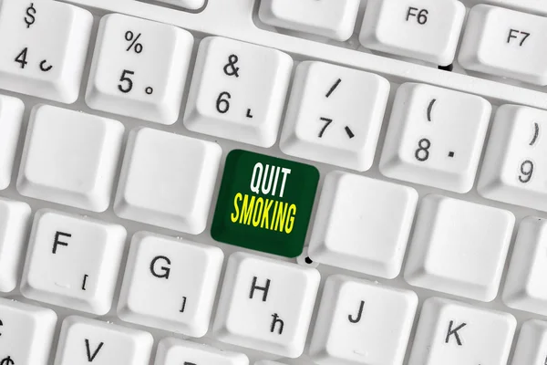 Handwriting text Quit Smoking. Concept meaning Discontinuing or stopping the use of tobacco addiction White pc keyboard with empty note paper above white background key copy space. — Stock Photo, Image