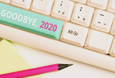 El yazısı metin Goodbye 2020. Kavram anlamı Yılbaşı Milestone Geçen Ay Kutlama Geçiş Beyaz pc klavye beyaz arka plan tuşu kopyalama alanı üzerinde boş not kağıdı ile.