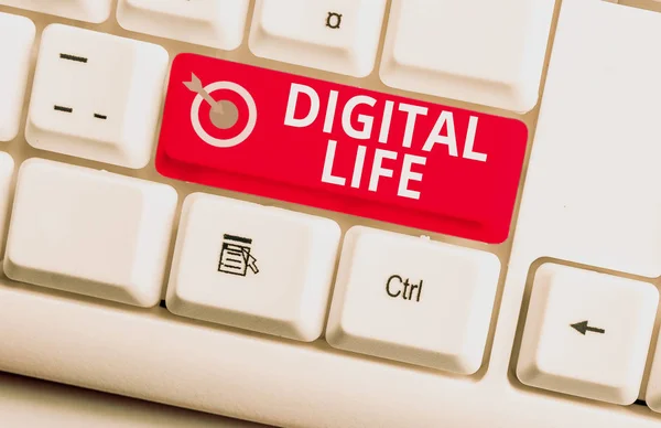 Handwriting text writing Digital Life. Concept meaning Living in a world interconnected through Internet Multimedia White pc keyboard with empty note paper above white background key copy space.