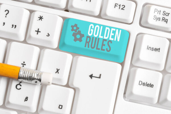 Writing note showing Golden Rules. Business photo showcasing Basic principle that should be followed Important Principle White pc keyboard with note paper above the white background.