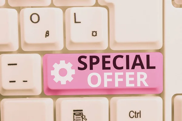 Writing note showing Special Offer. Business photo showcasing Discounted price Markdown Promotional Items Crazy Sale White pc keyboard with note paper above the white background.