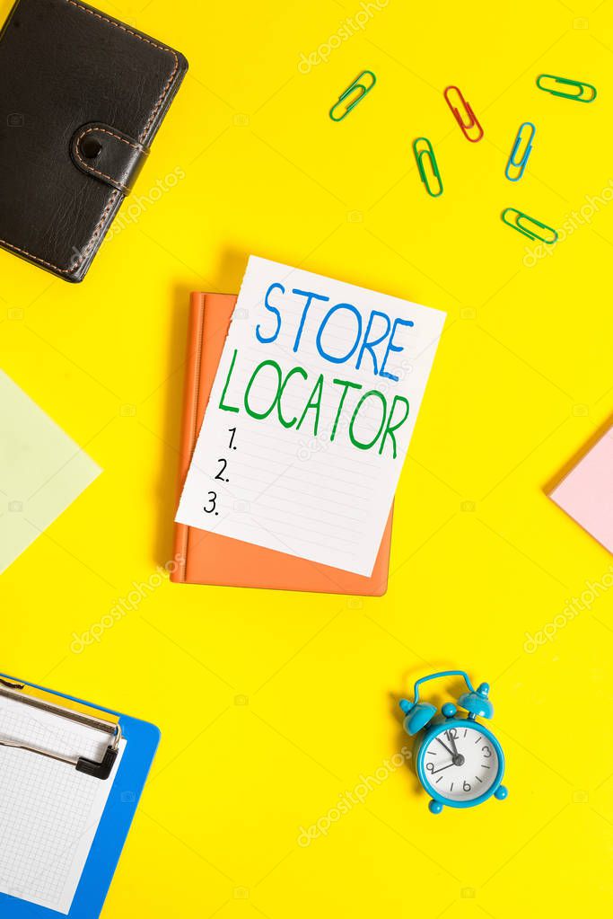 Handwriting text Store Locator. Concept meaning to know the address contact number and operating hours Paper clips with blank papers for text messages.