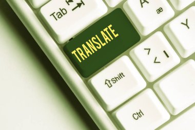 El yazısı metin yazma Çevir. Kavram anlamı Bir hedef dil beyaz pc klavye ile aynı eşdeğer anlamı olan başka bir kelime beyaz arka plan tuşu kopyalama alanı üzerinde boş not kağıdı ile.