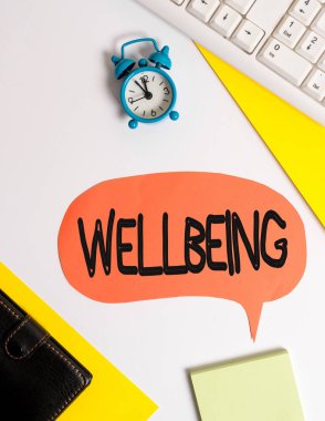 Kelime yazma metni Wellbeing. Sağlık Düz de dahil olmak üzere varoluşun iyi ya da tatmin edici bir durum için İş kavramı kabarcık kağıt saat ve ataş üzerinde kopya alanı ile yatıyordu.
