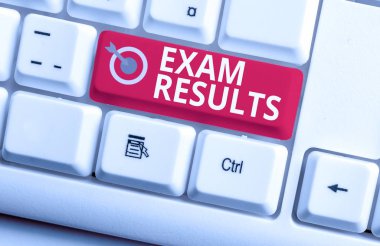 Handwriting text writing Exam Results. Concept meaning An outcome of a formal test that shows knowledge or ability White pc keyboard with empty note paper above white background key copy space. clipart