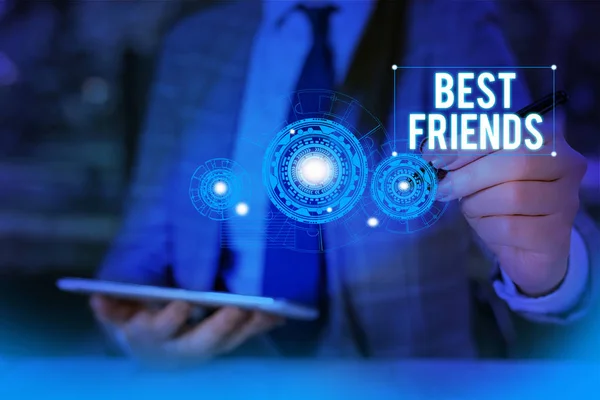 Writing note showing Best Friends. Business photo showcasing A demonstrating you value above other demonstratings Forever buddies Woman wear formal work suit presenting presentation using smart device — Stock Photo, Image