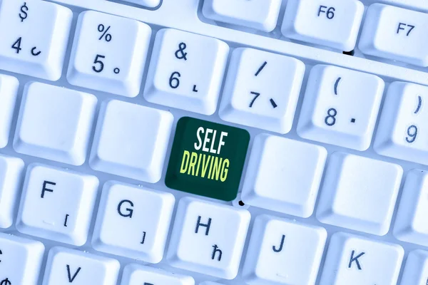 Handwriting text Self Driving. Concept meaning Autonomous vehicle Ability to navigate without huanalysis input White pc keyboard with empty note paper above white background key copy space.