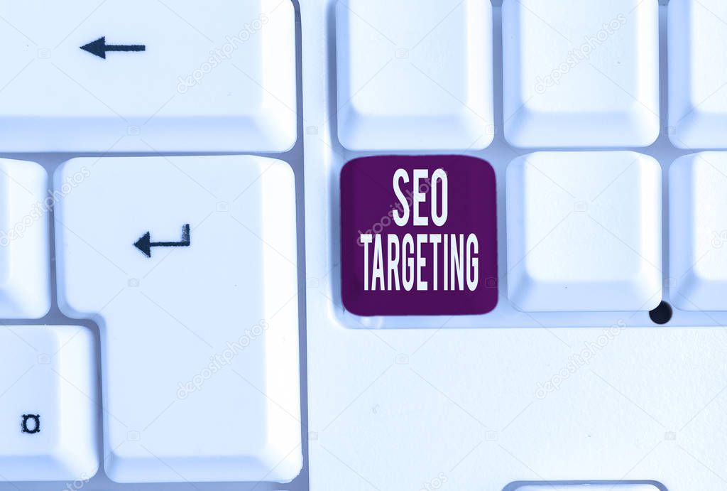 Writing note showing Seo Targeting. Business photo showcasing Specific Keywords for Location Landing Page Top Domain White pc keyboard with note paper above the white background.