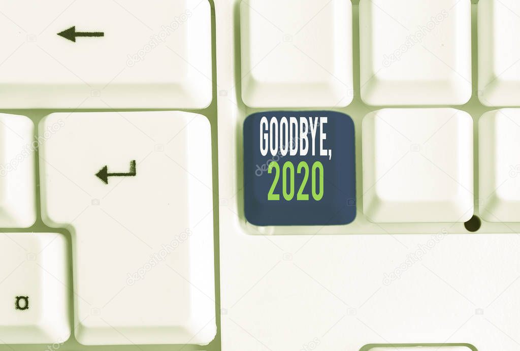 Word writing text Goodbye 2020. Business concept for New Year Eve Milestone Last Month Celebration Transition White pc keyboard with empty note paper above white background key copy space.