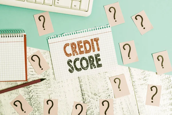 Text sign showing Credit Score. Conceptual photo Represent the creditworthiness of an individual Lenders rating Writing tools, computer stuff and math book sheet on top of wooden table.