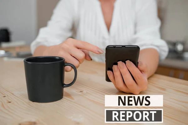 Text sign showing News Report. Conceptual photo spoken or written account of something that one has observed woman using smartphone office supplies technological devices inside home. — Stock Photo, Image