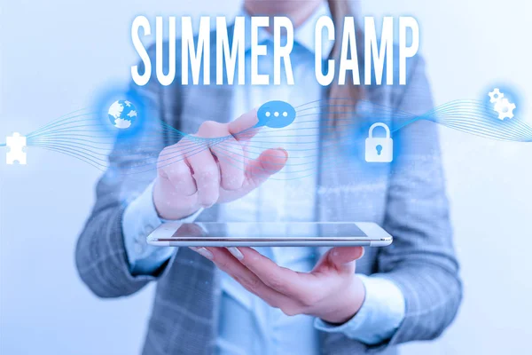 Handwriting text Summer Camp. Concept meaning Supervised program for kids and teenagers during summertime. Female human wear formal work suit presenting presentation use smart device. — Stockfoto