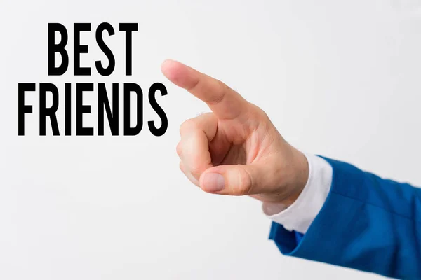 Writing note showing Best Friends. Business photo showcasing A demonstrating you value above other demonstratings Forever buddies Isolated hand pointing with finger. Business concept pointing finger. — Stock Fotó