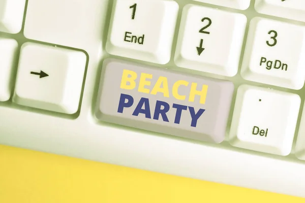 Handwriting text Beach Party. Concept meaning small or big festival held on sea shores usually wearing bikini White pc keyboard with empty note paper above white background key copy space.