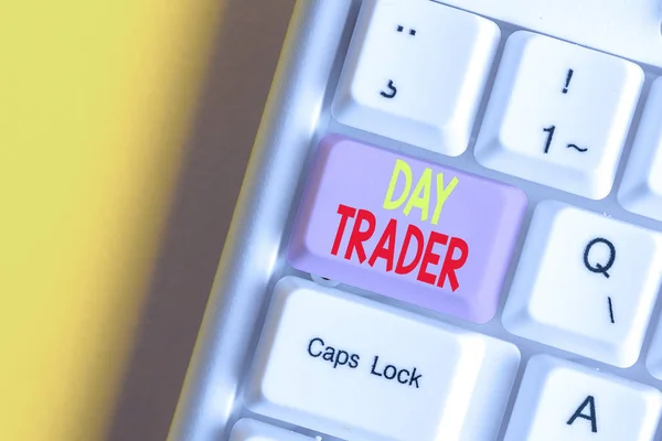 Word writing text Day Trader. Business concept for A demonstrating that buy and sell financial instrument within the day White pc keyboard with empty note paper above white background key copy space.