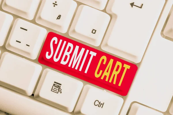 Handwriting text writing Submit Cart. Concept meaning Sending shopping list of online items Proceed checkout White pc keyboard with empty note paper above white background key copy space.