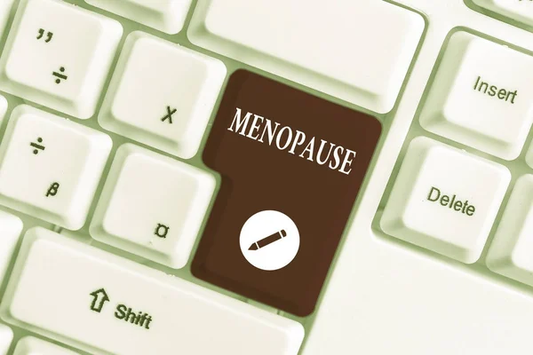 Kézírás szöveg írása menopauza. Koncepció szerinti időszak peranalysisent megszüntetése vagy vége a menstruáció ciklus fehér PC billentyűzet üres jegyzet papírt a fehér háttér-kulcs másolási tér. — Stock Fotó