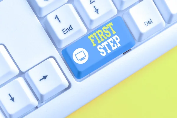 Text sign showing First Step. Conceptual photo Pertaining to the start of a certain process or beginning White pc keyboard with empty note paper above white background key copy space.
