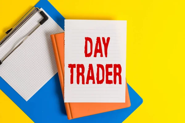 Word writing text Day Trader. Business concept for A demonstrating that buy and sell financial instrument within the day Pile of empty papers with copy space on the table.