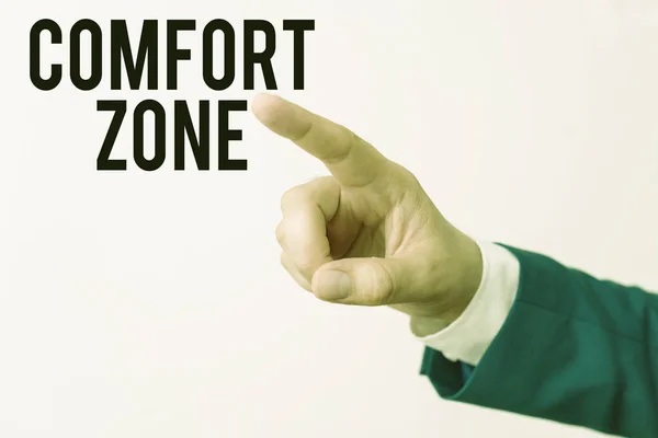 Writing note showing Comfort Zone. Business photo showcasing A situation where one feels safe or at ease have Control Isolated hand pointing with finger. Business concept pointing finger.