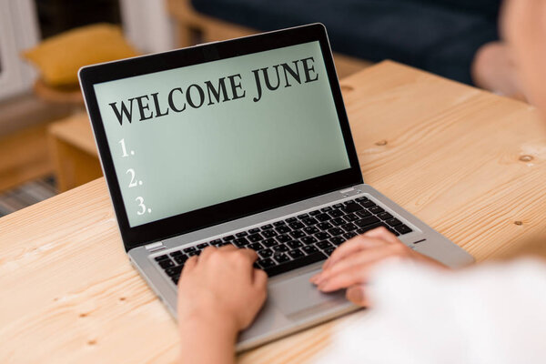Word writing text Welcome June. Business concept for Calendar Sixth Month Second Quarter Thirty days Greetings woman laptop computer smartphone mug office supplies technological devices.