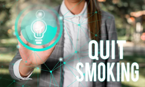 Handwriting text Quit Smoking. Concept meaning Discontinuing or stopping the use of tobacco addiction Female human wear formal work suit presenting presentation use smart device.