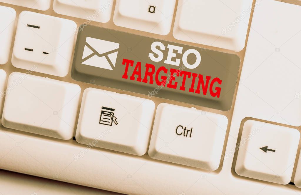 Conceptual hand writing showing Seo Targeting. Business photo showcasing Specific Keywords for Location Landing Page Top Domain White pc keyboard with note paper above the white background.