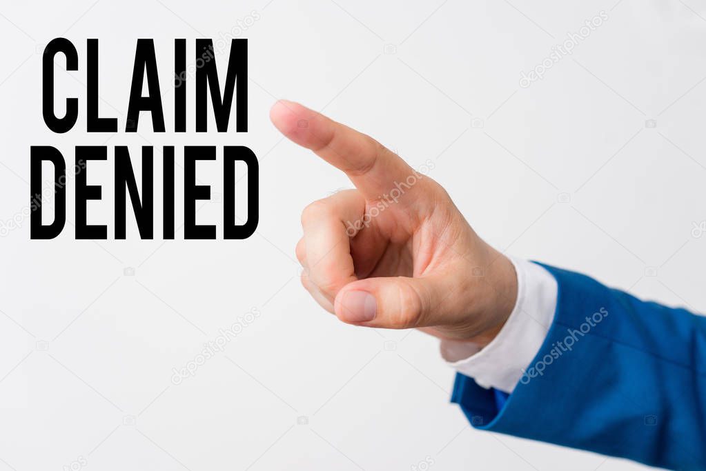 Writing note showing Claim Denied. Business photo showcasing Requested reimbursement payment for bill has been refused Isolated hand pointing with finger. Business concept pointing finger.