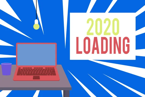 Text sign showing 2020 Loading. Conceptual photo Advertising the upcoming year Forecasting the future event Front view open laptop lying on wooden desktop light bulb falling glass.