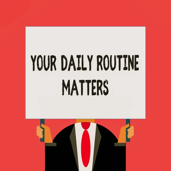 Word writing text Your Daily Routine Matters. Business concept for practice of regularly doing things in fixed order Just man chest dressed dark suit tie no face holding blank big rectangle.
