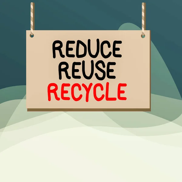 Az újrahasználat újrahasznosításának csökkentése című írásos jegyzet. Üzleti fotó bemutató környezetvédelmi felelőtlen fogyasztói magatartás fa deszka fa üres keret rögzített színes csíkos string. — Stock Fotó