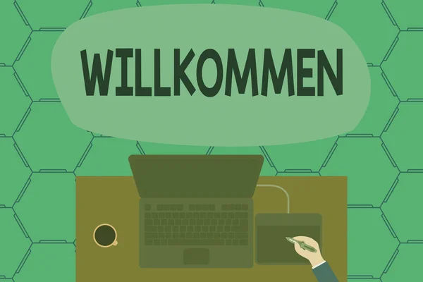 Conceptual hand writing showing Willkommen. Business photo showcasing welcoming showing event or your home something to that effect Laptop wooden desk worker drawing tablet coffee cup office. — Stock Photo, Image