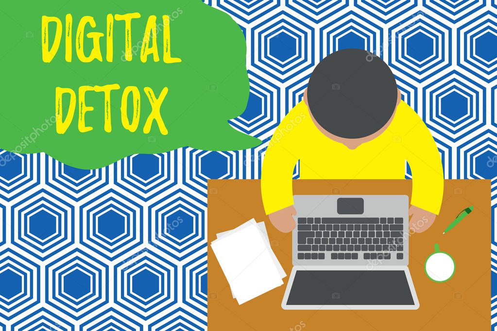 Text sign showing Digital Detox. Conceptual photo Free of Electronic Devices Disconnect to Reconnect Unplugged Upper view young man sitting working table laptop documents coffee cup pen.