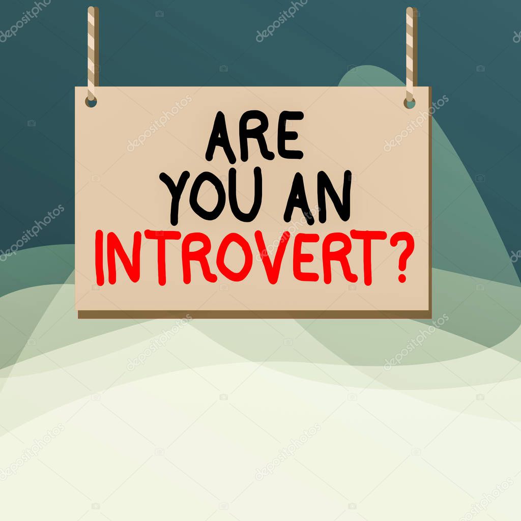 Writing note showing Are You An Introvertquestion. Business photo showcasing demonstrating who tends to turn inward mentally Wooden board wood empty frame fixed colorful striped string.