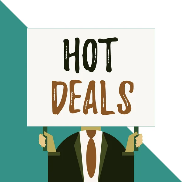 Conceptual hand writing showing Hot Deals. Business photo showcasing An agreement through which one of the paties is offered and accept Man chest dressed dark suit tie face holding big rectangle. — Stockfoto