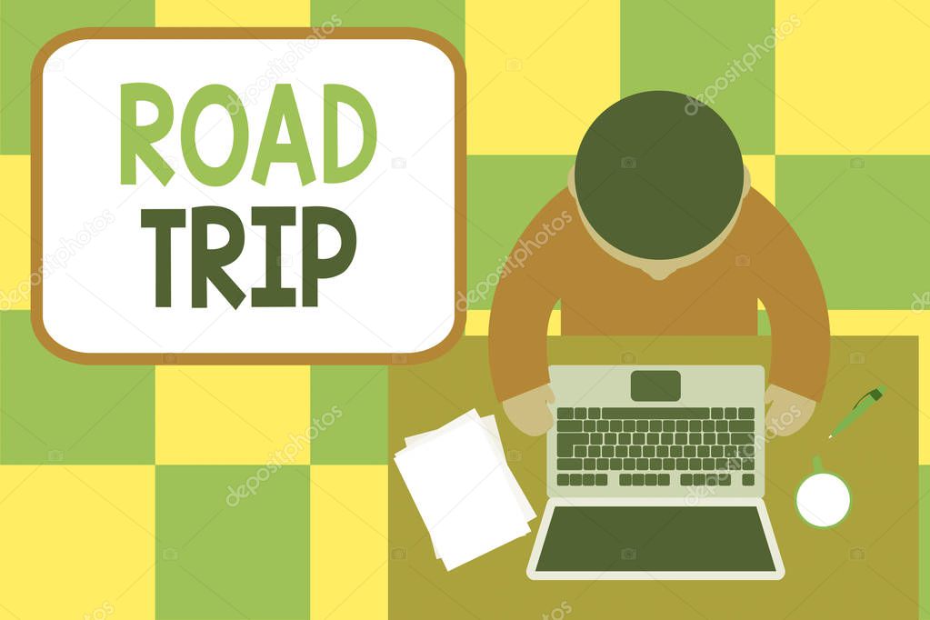 Conceptual hand writing showing Road Trip. Business photo showcasing Roaming around places with no definite or exact target location Upper view young man sitting table laptop coffee cup pen.